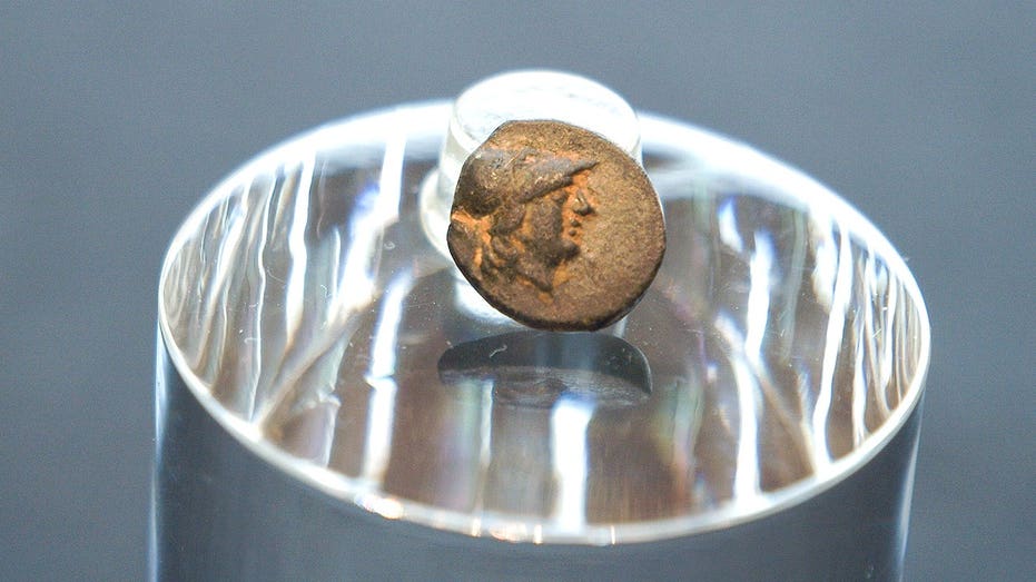 Teen stumbles on mysterious coin from legendary city, puzzling archaeologists over its journey Education NSW